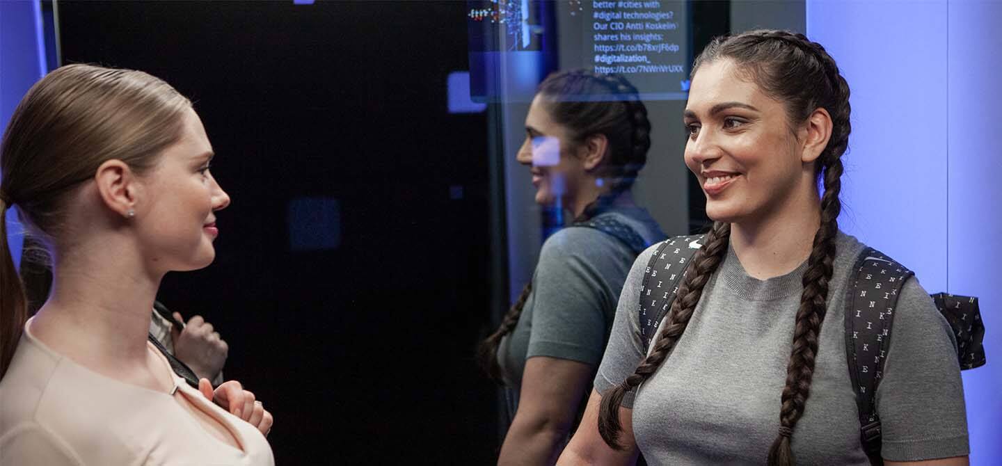 img_happy_women_in_elevator_1440x670